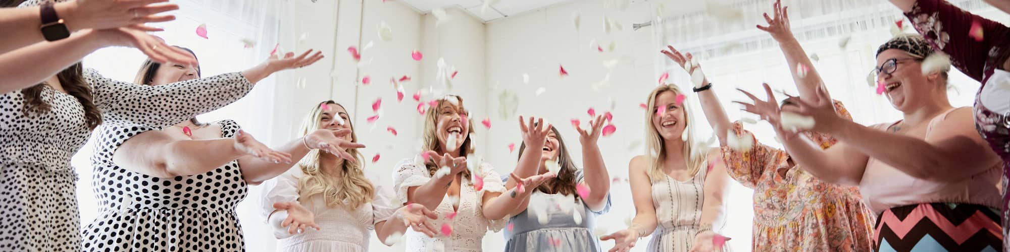 Throwing confetti at New Moon Circles event in South Wales